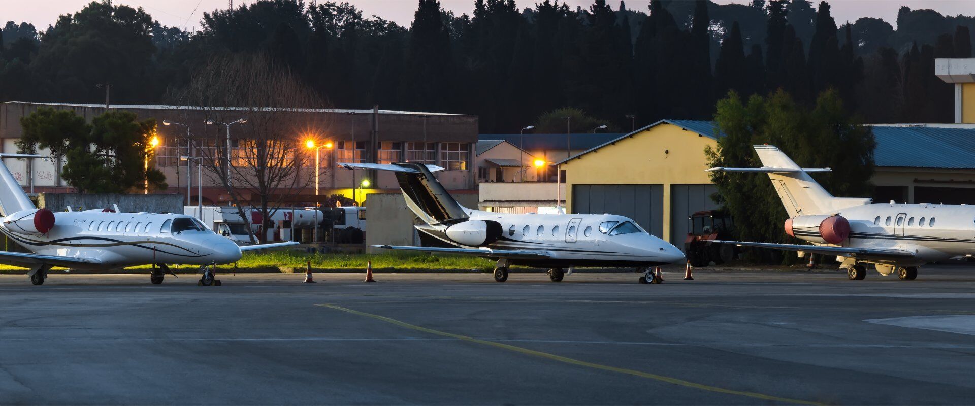 Three private jets on stand parked at the airport ► Charter-A Ltd Charter-a ltd three private jets on stand parked at the airport