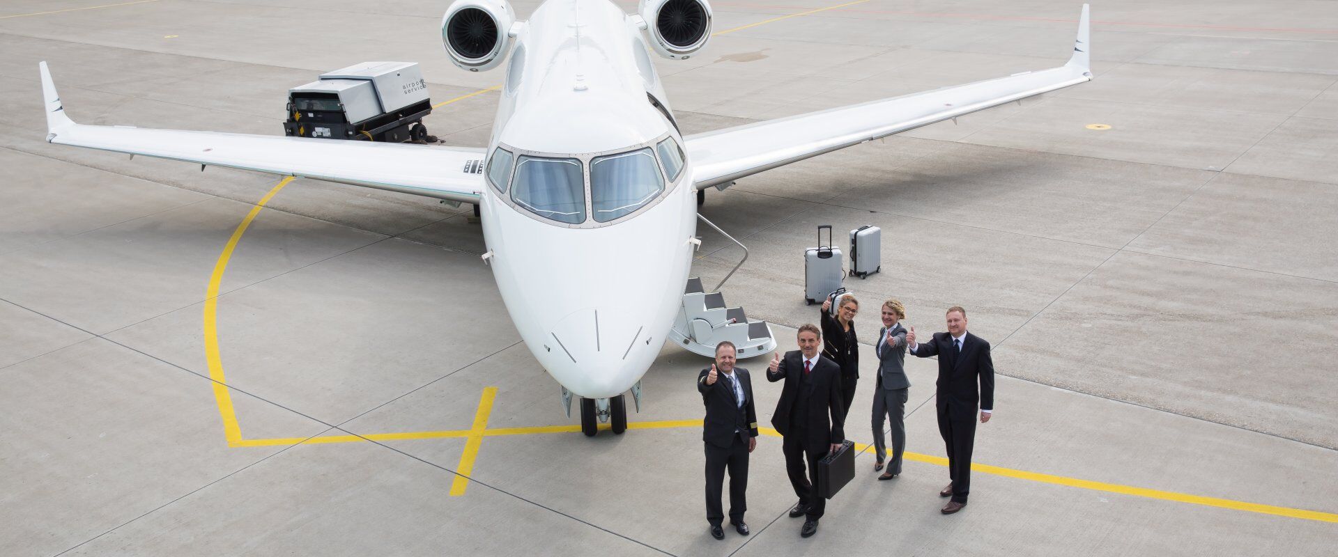 Executive,Business,Team,Corporate,Jet ► Charter-A Ltd Charter-a ltd private jet team glasgow on the airport apron with a jet